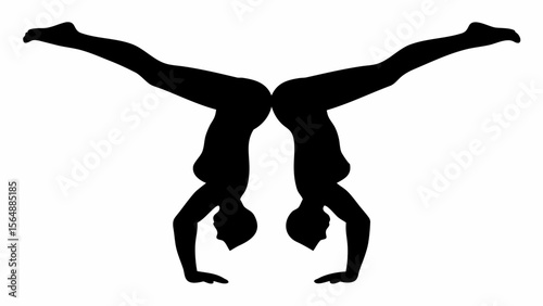 Silhouette of two women doing handstands mirrored against each other in a symmetrical composition