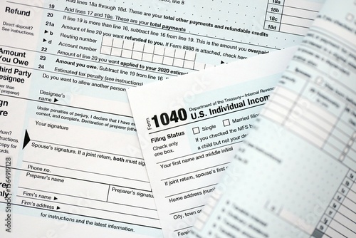 1040 US individual income tax return form blank close up. Few pages of united states tax blank photo