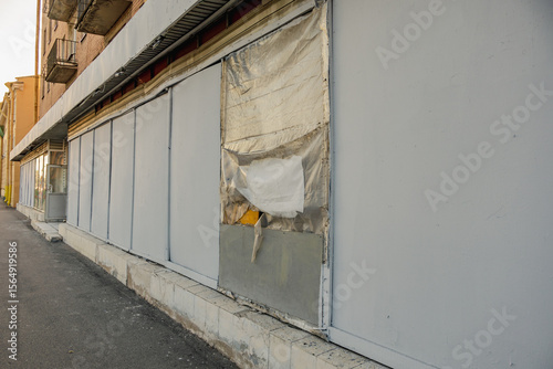 Store facade is damaged as result of vandalism