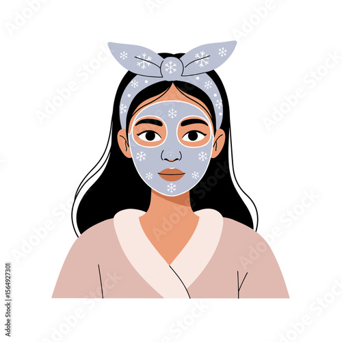 Young woman with cloth mask on her face relaxing at home in bathrobe