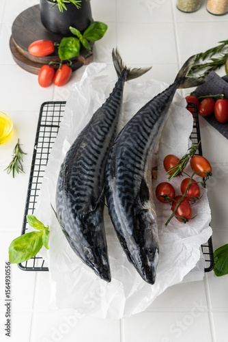 fresh mackerel fish carcass on a bright table. preparation for cooking dinner. fish in the oven on the grill. raw, unpeeled fish