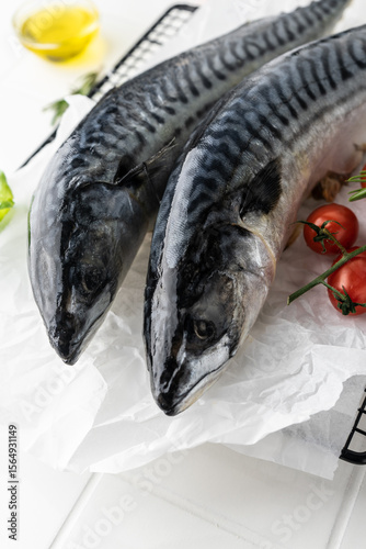 fresh mackerel fish carcass on a bright table. fish in the oven on the grill. raw, unpeeled fish