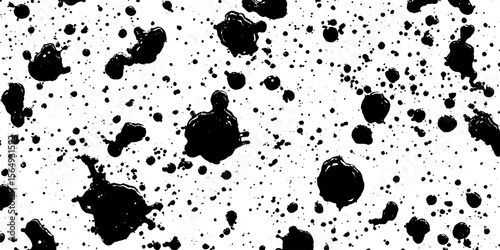 Chaotic black ink splatters and drops on white background for artistic design