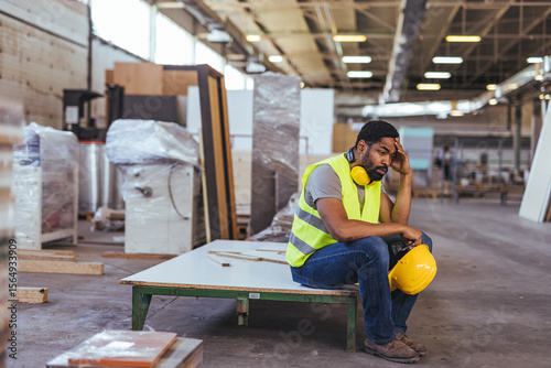 Photography Tired Factory Worker Sitting on a Bench in an Industrial Setting