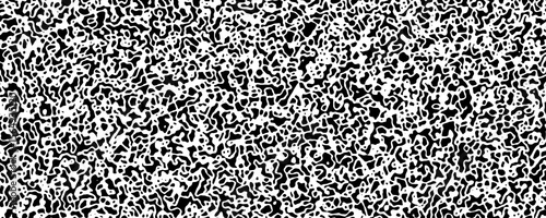 An abstract, high-contrast image filled with intricate, organic shapes in black and white