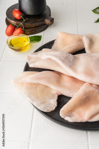 processed squid fillet. raw seafood. blank on a light background. preparation