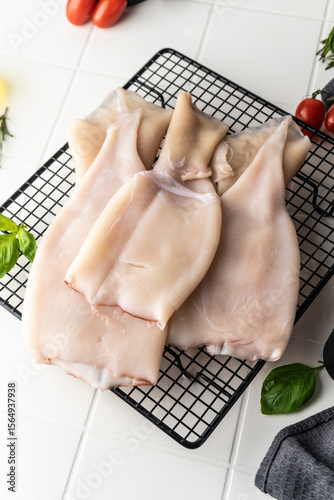 processed squid fillet. raw seafood. blank on a light background. preparation