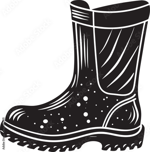Black garden boot with mud splatters footwear gardening