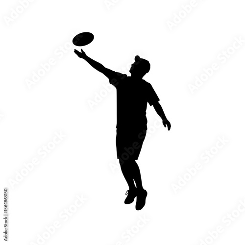 Silhouette of young man throwing frisbee in dynamic pose outdoors  