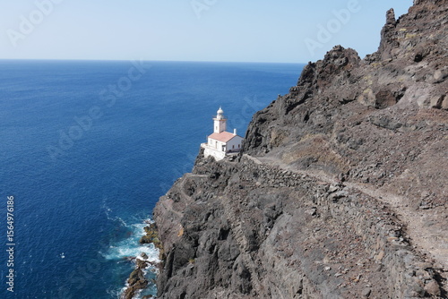 Weg über Fels zum Leuchtturm am Meer auf São Vicente in Kap Verde Farol da D. Amélia photo