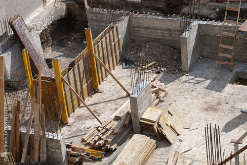 Monolithic construction. Installation of load-bearing wall formwork for concrete pouring. Top view