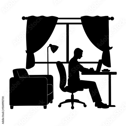 Silhouette of man working at desk with laptop, remote work home office