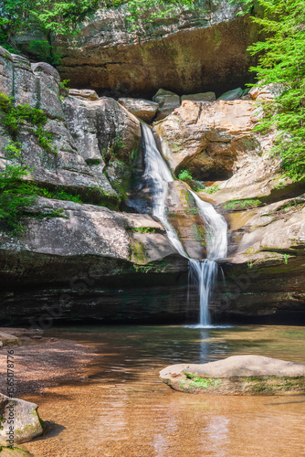 Cedar Falls in summer time. Valley of Queer Creek in Hocking Hills state park. Ohio