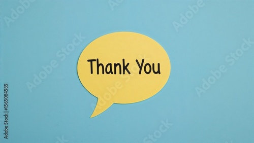 Bright yellow thank you bubble on blue canvas