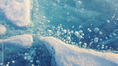 Frozen lake bubbles trapped under ice forming cellular structures. Cool blue/white palette with subtle turquoise undertones