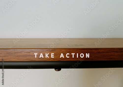 Wood shelf with text written Take Action - means to do something now or to act in order to get a particular result, no more procrastination