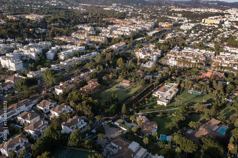 Marbella's Golden Mile: Coastal Luxury and Mediterranean Beauty
An aerial view of Marbella's coastline, showcasing a long sandy beach, azure sea, and exclusive villas nestled among lush greenery Marbella's Golden Mile: Coastal Luxury and Mediterranean Beauty
An aerial view of Marbella's coastline, showcasing a long sandy beach, azure sea, and exclusive villas nestled among lush greenery