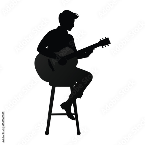 Silhouette of a Musician Playing Acoustic Guitar