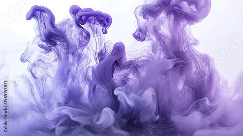 Elegant purple ink in water abstract formation creates a dreamlike and serene artistic aesthetic for backgrounds or creative designs