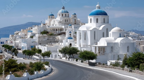 Fototapeta Naklejka Na Ścianę i Meble -  Soft sunlight illuminates the charming streets , showcasing stunning white structures with blue domes and lush greenery