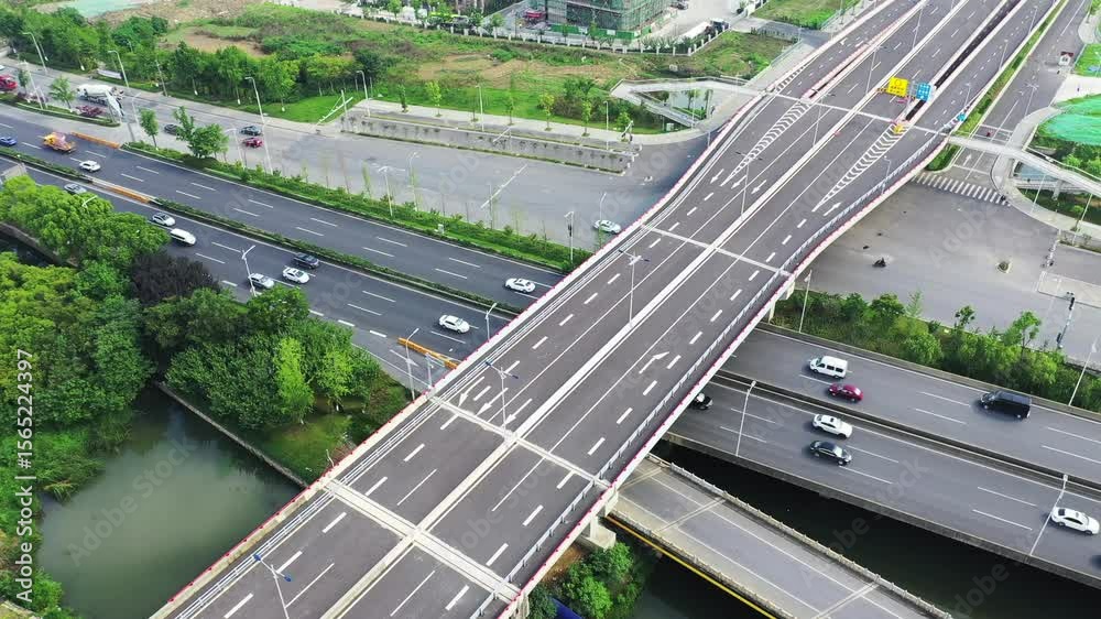 Urban viaduct traffic overview showcasing vehicles and infrastructure in a bustling city setting