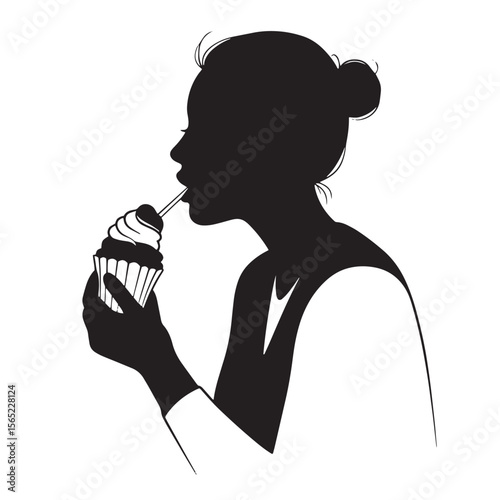 Silhouette of a woman eating a cupcake enjoying a sweet treat and delicacy