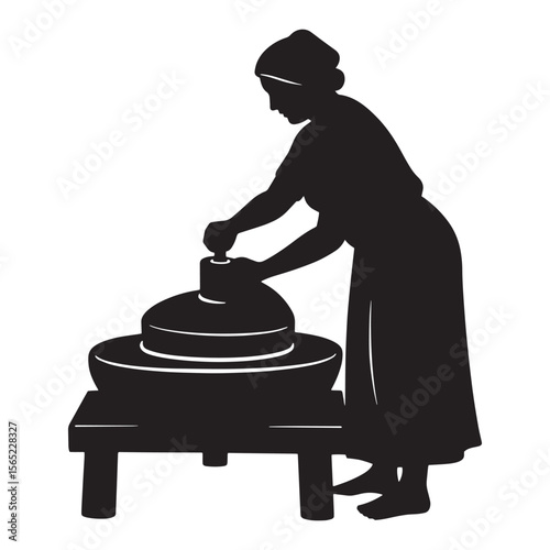 Silhouette of a woman grinding grain with a traditional stone mill against white background
