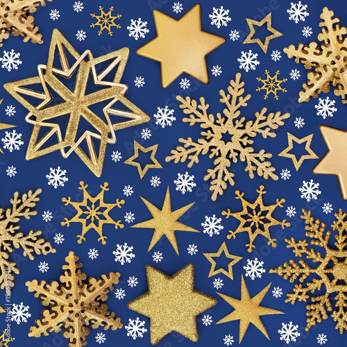 Wallpaper Mural Christmas gold star, snowflake decorations with white snowflakes background on blue. Festive abstract design for holiday Xmas season. Greeting card. Torontodigital.ca