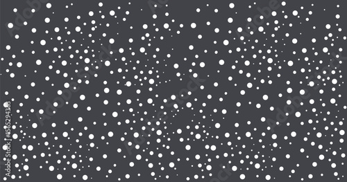 Seamless pattern of random black polka dots on a clean white background. Abstract dotted texture ideal for wrapping paper, fabric, and digital design. Modern minimal repeat surface design.