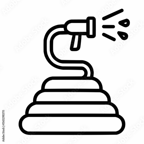 Coiled hose with water spray. Summer yard care