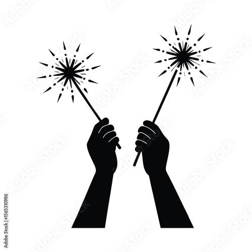 Dynamic silhouette of bright sparklers glowing and illuminating a hand during a festive celebration or event