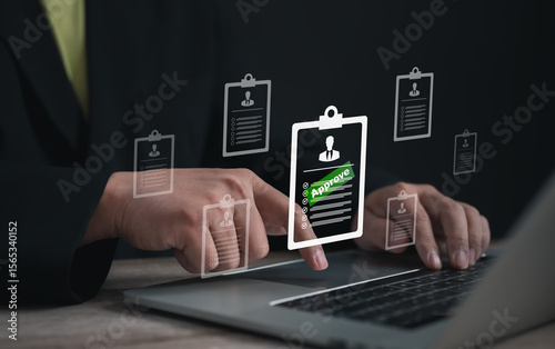 Hands of a businessman selecting a digital clipboard resume marked “Approve” on laptop screen, representing HR recruitment, candidate selection, and job application approval in digital workplace.