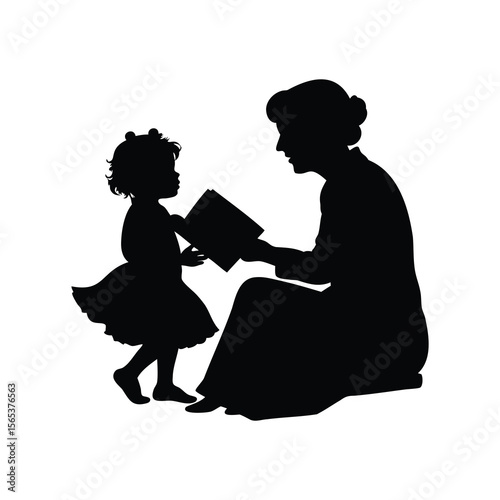 A sweet moment of mother reading to a little girl silhouette