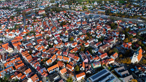 Fototapeta Naklejka Na Ścianę i Meble -  Aerial view of the old town of the city Metzingen
 in Germany on a sunny afternoon in autumn