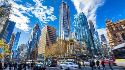 A busy city street with a lot of traffic and people walking