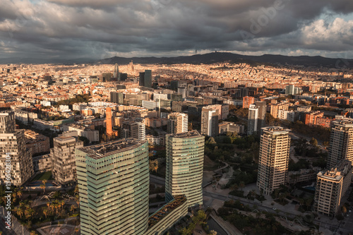 Photography An aerial view of Barcelona's expansive coastline, featuring a wide sandy beach,