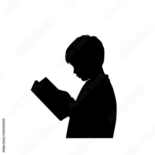 Silhouette of a young boy absorbed in reading a book, showcasing concentration and the joy of learning