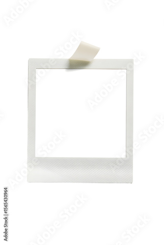 Vintage Memory Snapshot: A blank, classic instant photo frame, affixed with a piece of tape, offering a nostalgic glimpse into moments, a blank canvas ready for your unique touch.