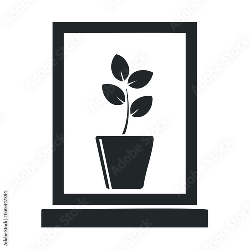 Silhouette of potted plant on windowsill in black and white