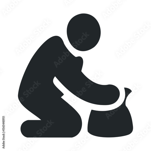 Silhouette of person gardening with spade and seedling