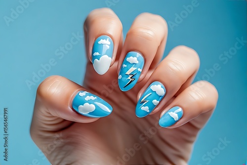 Baby blue nails with cloud and lightning bolt designs