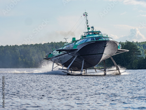 A high-speed hydrofoil tourist boat travels at high speed on Lake Onega in Karelia, northwest Russia