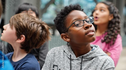 School field trip day with young students visiting the natural history museum to look at dinosaur fossils for science class