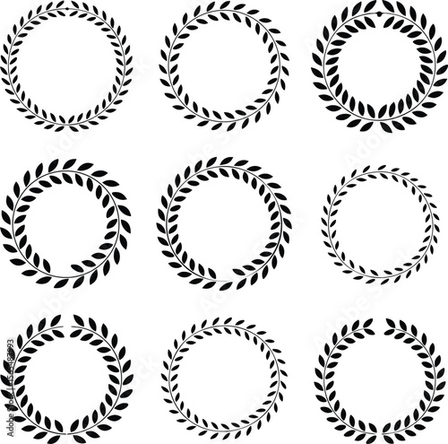 Elegant collection of nine black laurel wreath circle frames isolated on a white background