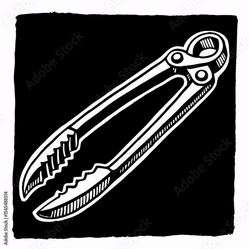 White tongs with serrated edges on black kitchen utensil cooking
