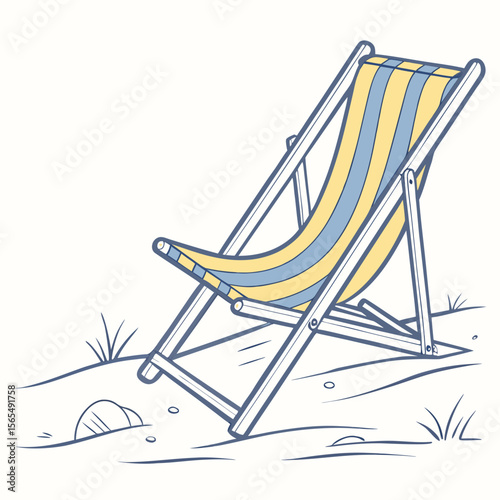 Striped beach chair on sandy ground with grass yellow blue