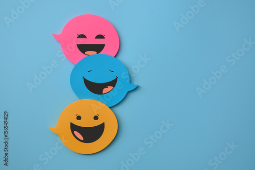 colorful speech bubbles with smiles, a concept of fun communication and correspondence