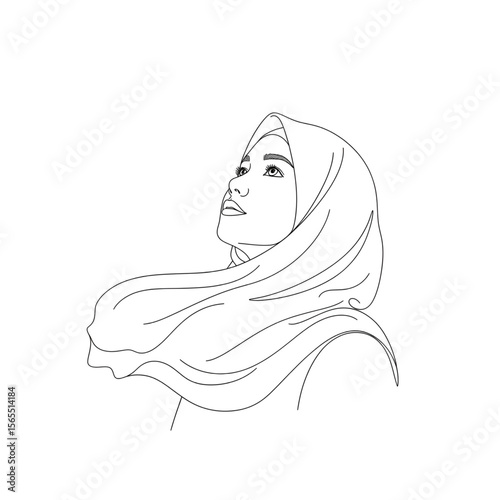 Muslim girl in hijab holding a cup and looking out the window