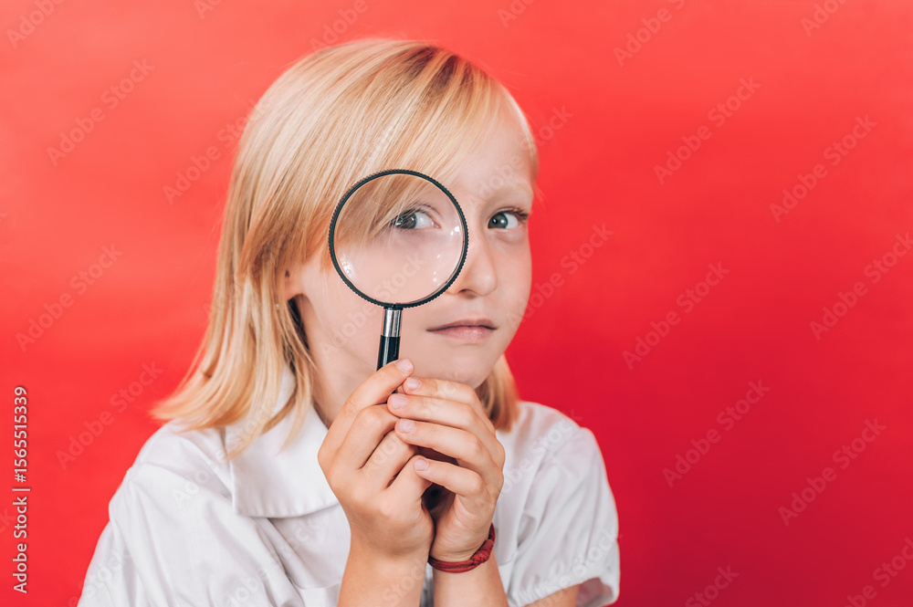 Young Child with Magnifying Glass: Exploring Future Career Opportunities. Young Child with Magnifying Glass: Exploring Future Career Opportunities.
