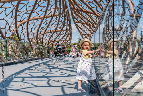 Bilde på lerret Sochi, Russia - 8 June 2025: Child girl walks across an unusual pedestrian bridg